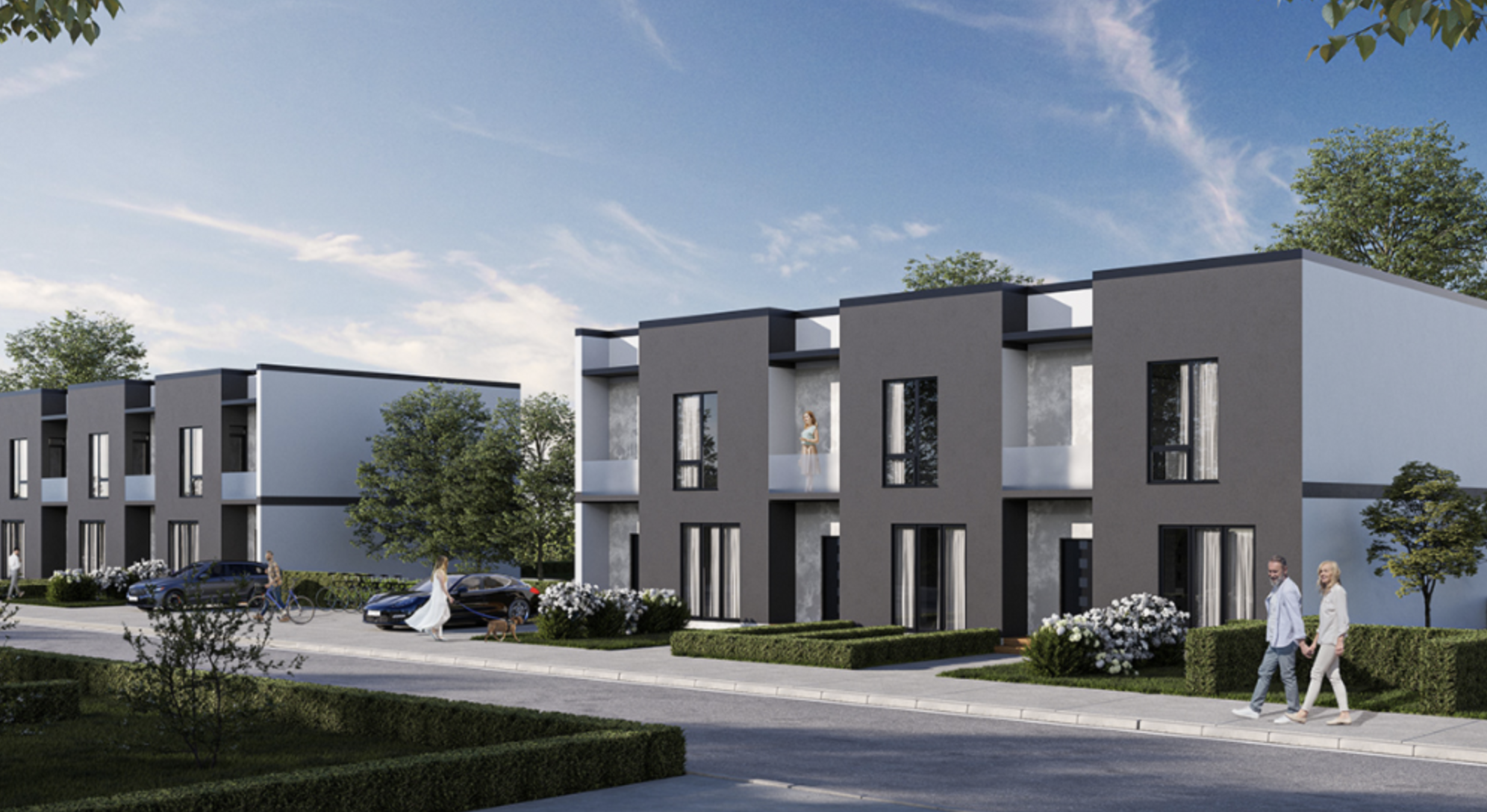Modern grey townhome residential development with landscaped street